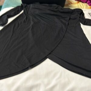 This is a size medium it is a hooded poncho-type pullover with long sleeves